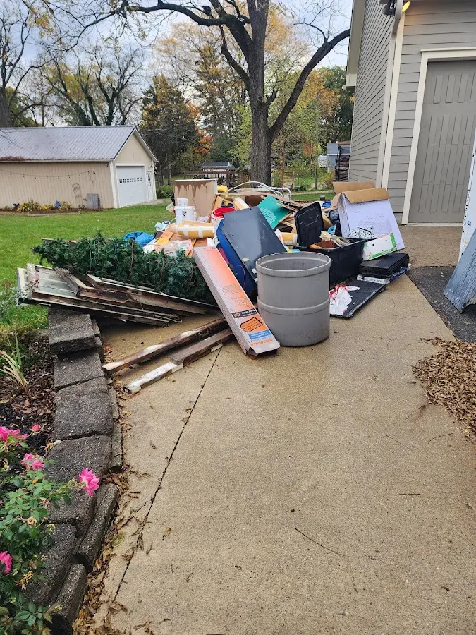 Dumpster being loaded with debris for Estate Cleanout Dumpster Rental in Hawthorne